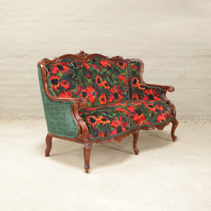 Antique french carved sofa in bright florals