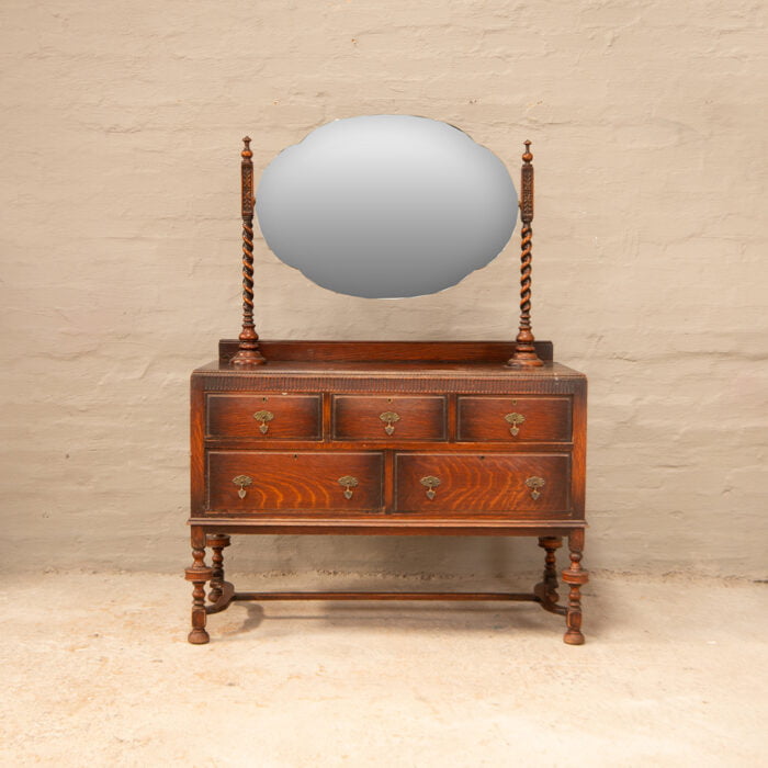 Antique dressing chest with oval mirror