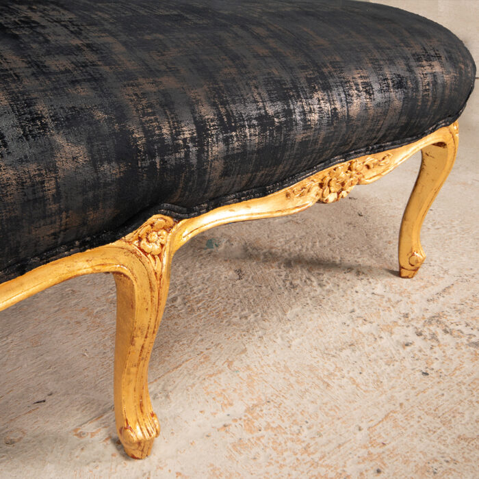 French style carved chaise with gold leaf and black velvet