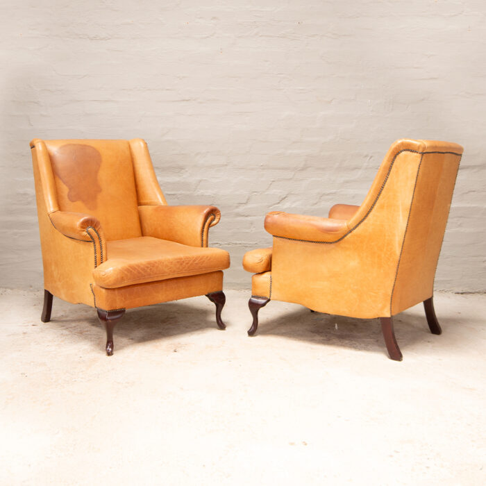 Vintage high back armchairs in leather
