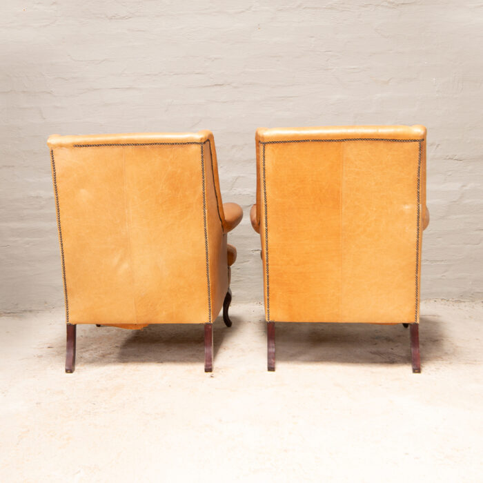 Vintage high back armchairs in leather