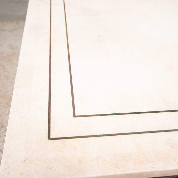 Travertine table with metal inserts