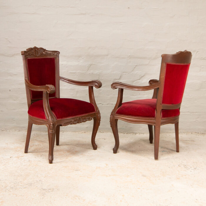 Carved armchairs in red
