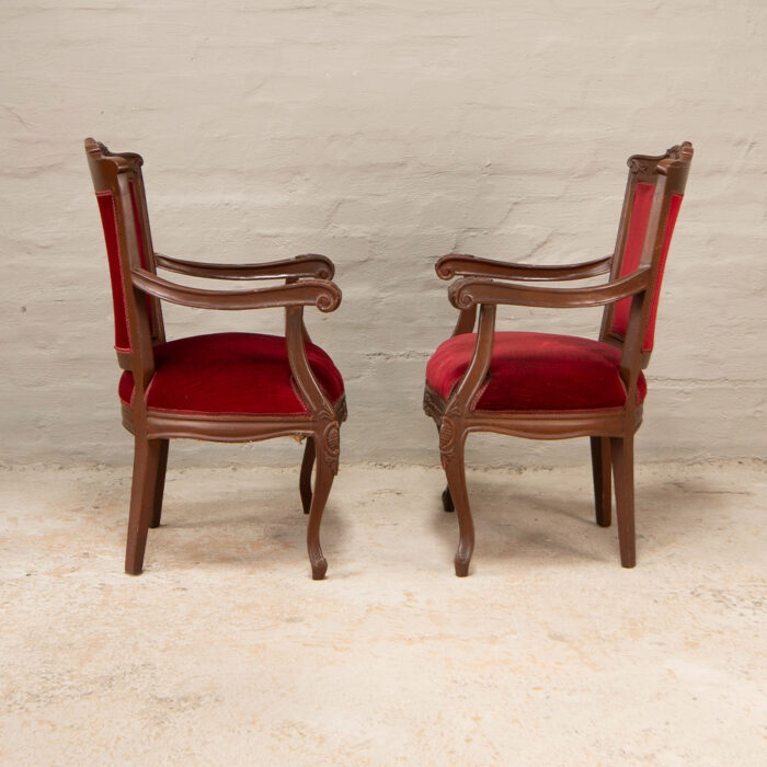 Carved armchairs in red